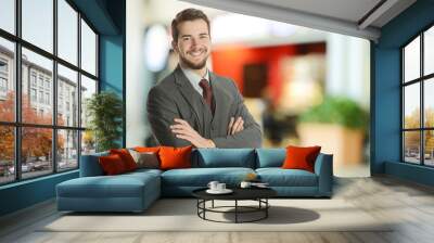 Young Businessman at the airport Wall mural