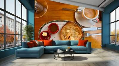 Traditional Madrid breakfast with coffee with milk and grilled croissant Wall mural