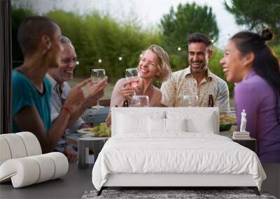 Happy middle-aged men and women toasting healthy food at farm house picnic - Life style concept with cheerful friends having fun together on afternoon relax time Wall mural