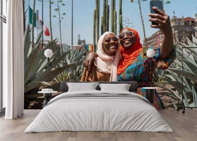 African mom and daughter traveling Wall mural