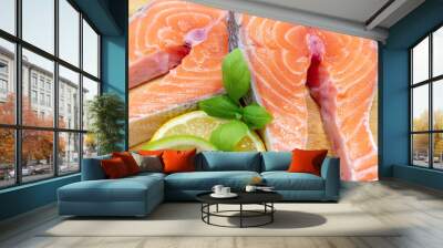 two raw salmon fillets and some lemon slices Wall mural