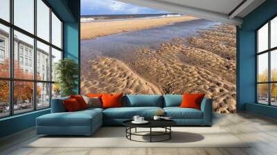 Beautiful sandy beach landscape with sand dunes and low sea tide stream water under blue sky with cloud in Spring in Norfolk East Anglis uk Wall mural