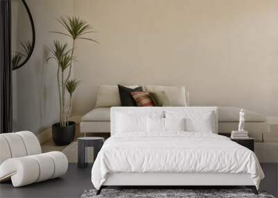 a living room with a couch, coffee table and two planters on the floor in front of the sofa Wall mural