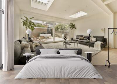 a living room with hardwood flooring and skylights on the ceiling, as well as it is in an apartment Wall mural