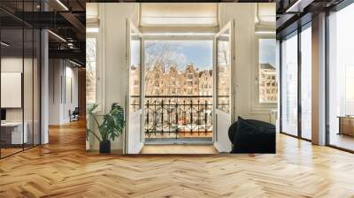 a living room with two windows, and a view of the city from it's front door that looks out onto the street Wall mural