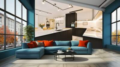 a modern kitchen with black cabinets and white countertops in the center of the image is an open - plan living room Wall mural