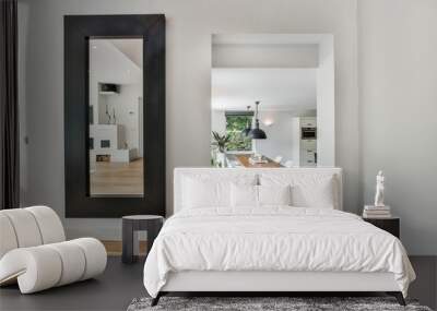 Modern room with different furniture and the bright light coming from the window Wall mural