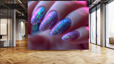 closeup of woman's manicured hand with freshly painted purple and green glitter finger nail polish Wall mural