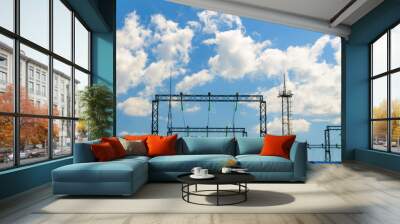 Electric substation on a sunny summer day, clouds in the sky Wall mural