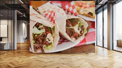 Burritos stuffed with meat and vegetables. Mexican food. Wall mural