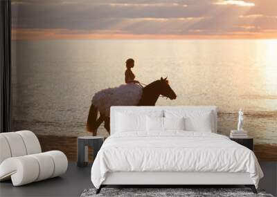 Bride on a horse at sunset by the sea Wall mural