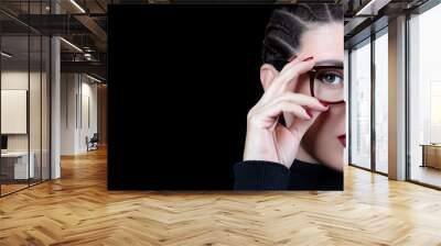 Beautiful woman with braided hair wearing glasses. vision care, optometry and fashion eye wear Wall mural