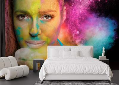 Beautiful young woman celebrating holi color festival Wall mural