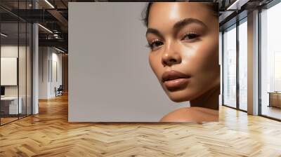 Beauty and Skincare Concept. Beautiful mixed-race woman face with flawless skin and healthy glow, closeup of serene face Wall mural