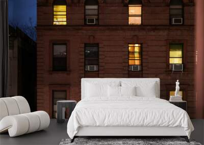 Facade of a typical brownstone apartment building at night, Harlem, New York City, NY, USA Wall mural