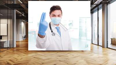 Doctor proctologist wearing white medical uniform Wall mural