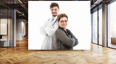 Male doctor and female senior patient standing back to back Wall mural