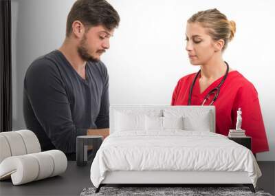 Male patient taking medicine from female doctor. Wall mural