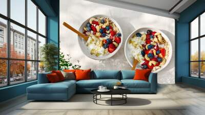 Coconut yogurt granola with strawberry, blueberry and cashew in white bowl. Concept of healthy breakfast, vegetarian meal, dieting, weight loss, healthy eating. Wall mural