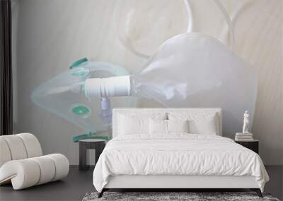 isolated oxygen medical mask for asthma or emergency patients at hospital on clean wooden table Wall mural