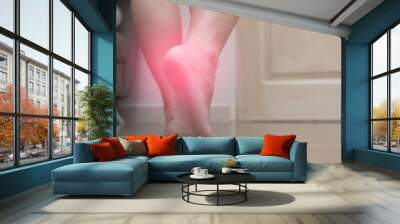 Closeup of female right foot heel pain, with red spot, plantar fasciitis Wall mural