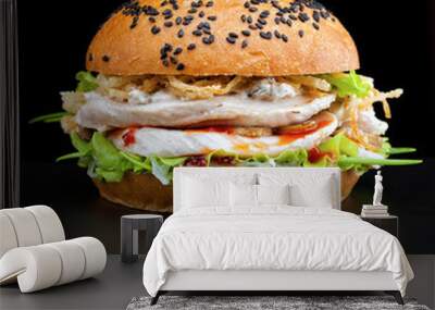 Thai chicken burger with crispy onion and spicy sauce on black background Wall mural