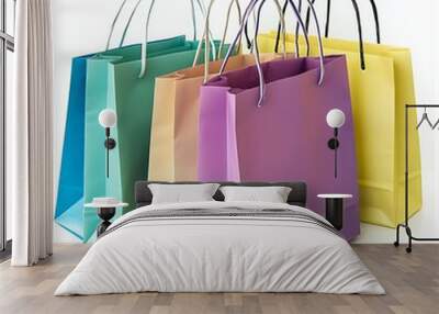 Plenty of colorful paper shopping bags on a white isolated background. Wall mural