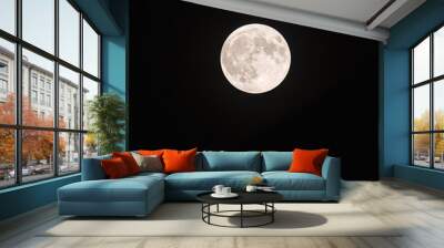 Bright harvest full moon isolated against black night sky. Wall mural