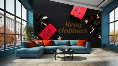 Christmas gift box and pine tree with xmas decoration on black b Wall mural