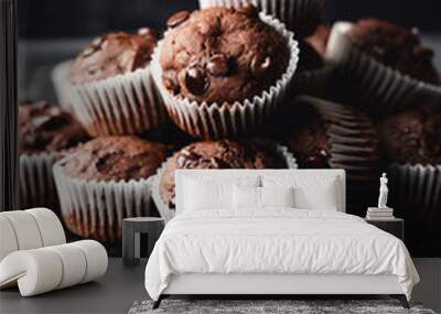 Close up of chocolate chip zucchini muffins on black background. Wall mural