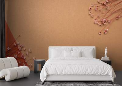 Dry flower branch on a light brown background. Trend, minimal dried concept with copyspace Wall mural