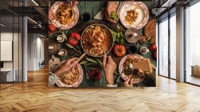 Family eating pasta Bolognese at Italian style dinner Wall mural