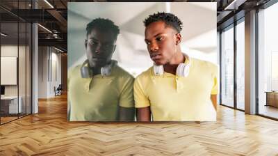 portrait of young african model leaning on the wall Wall mural