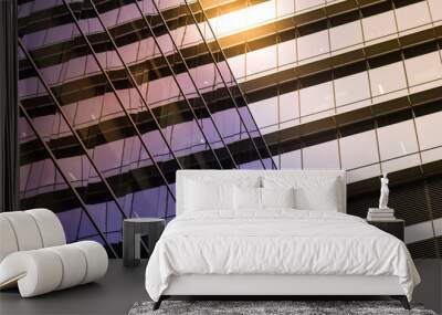 Reflective glass windows of a modern geometric building in sunlight Wall mural