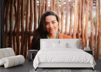 Woman posing in tropical setting Wall mural