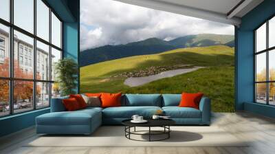 Sheep graze on the mountain Wall mural