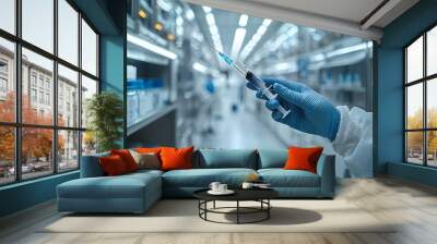 Doctor's hand in glove holding syringe Wall mural