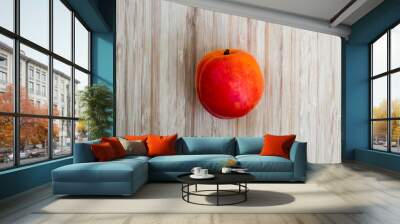 Ripe apricots against a wooden background. Wall mural