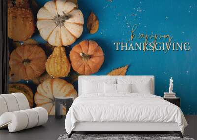 Happy Thanksgiving flat lay with pumpkin decoration on blue background for holiday. Wall mural