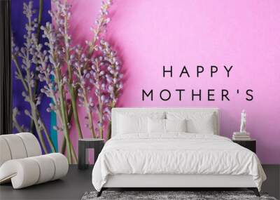 Liriope blooms on pink and purple background with mothers day greeting text. Wall mural