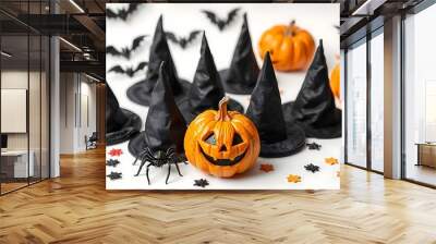 Halloween black and orange decor elements, collection of witch pointed hats, bats, spiders and creepy smiling Jack-o-lantern pumkins on white background, banner, poster created with generative ai Wall mural