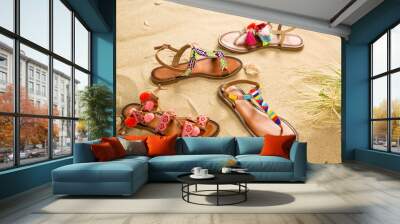 Colorful Sandals with Sand Beach Background Wall mural