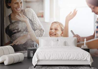 Messy, happy and children baking with mother for teaching and being crazy with flour. House, excited and girl kids with a mom, learning to cook and making a mess while cooking together in the kitchen Wall mural