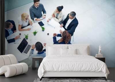 Top view, business people and staff in a meeting, feedback or conversation for report on a project, discussion or budget planning. Group, men or women with ideas, teamwork or cooperation with support Wall mural