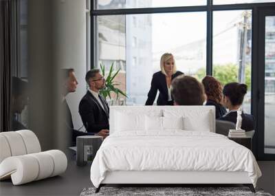 Ironing out the details. Shot of corporate businesspeople meeting in the boardroom. Wall mural