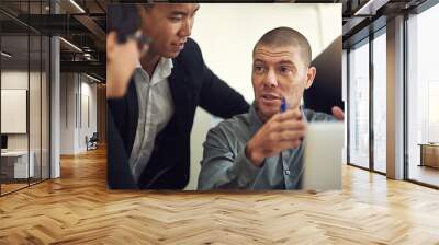 People who set goals are always more successful than others. Shot of a group of coworkers having a discussion in a boardroom. Wall mural