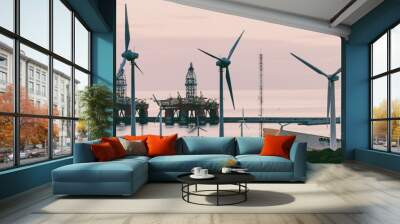 Group of windmills and solar panels for electric power production and oil rigs on coast. Wall mural