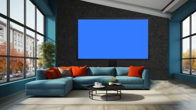 Mockup of modern desktop computer on dark background. blank blue screen display. front view Wall mural