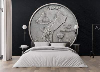 Old scratched Guam United States Quarter Dollar Coin on wooden table Wall mural