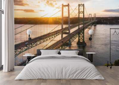 The sun setting behind the Narrows bridge in Tacoma Washington Wall mural